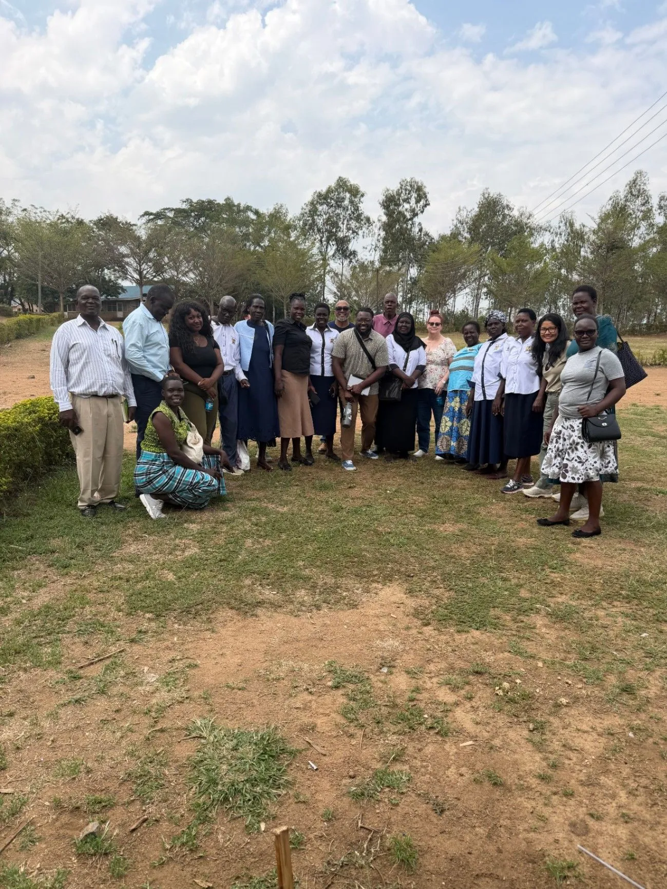 A large group of mental health professionals gathered outdoors in Kenya